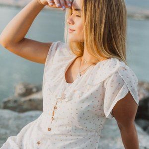 The Wistful Button Ruffle Dress in Natural